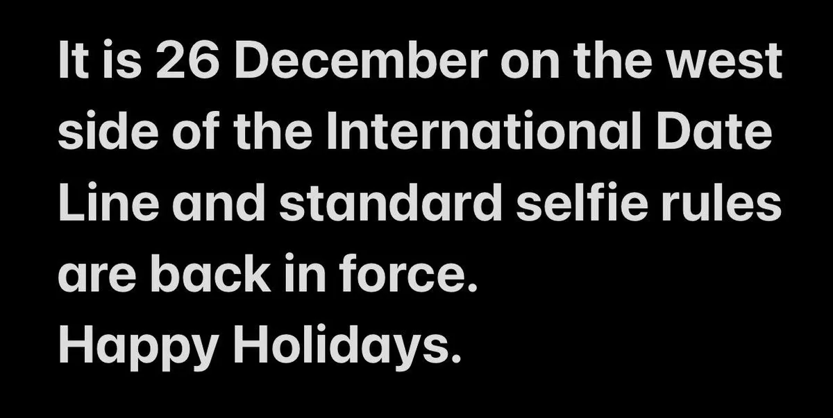 The image is a plain black background with white text that reads: 'It is 26 December on the west side of the International…