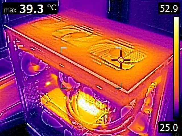 A thermal imaging view of a computer case shows the top surface at 39.3°C, the right side at 52.9°C, and the bottom at…