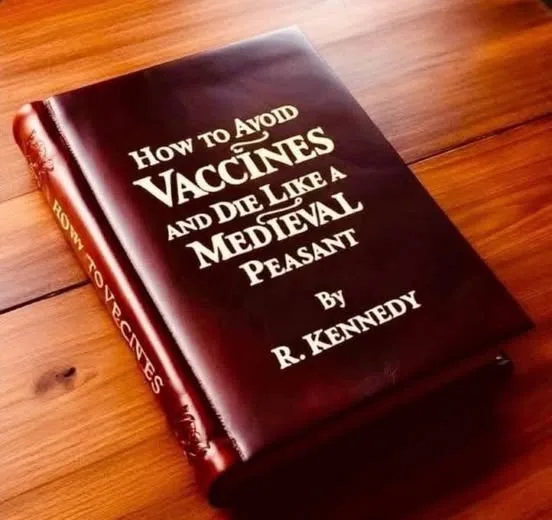 A dark brown leather-bound book titled 'How to Avoid Vaccines and Die Like a Medieval Peasant' by R. Kennedy rests on a…