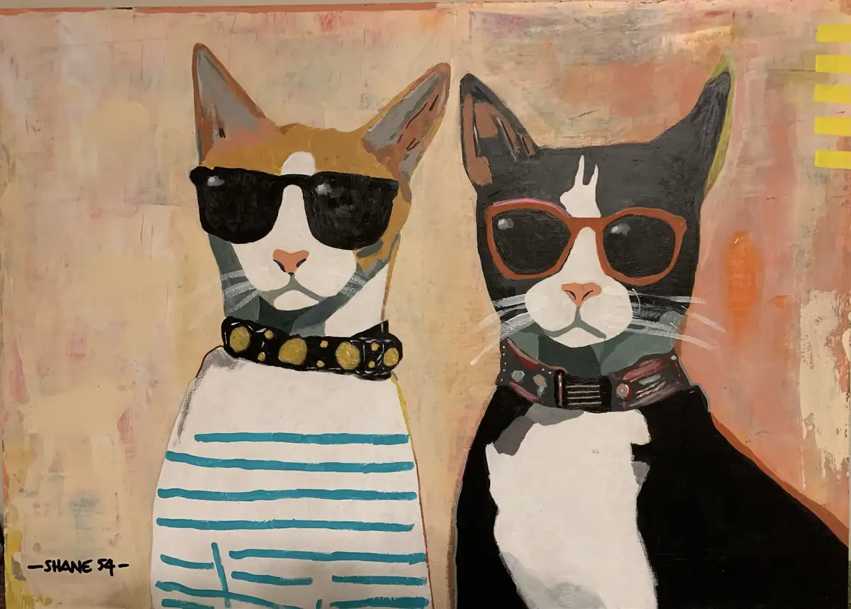 A painted artwork shows two stylized cats side-by-side, both wearing sunglasses and collars. The cat on the left is tan and…