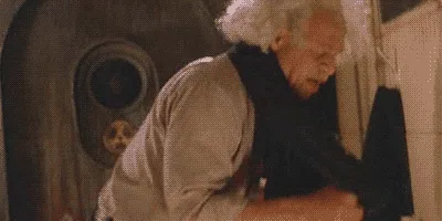 The image shows a split-screen of three frames: top row features an older man with white hair in a sci-fi setting, looking…