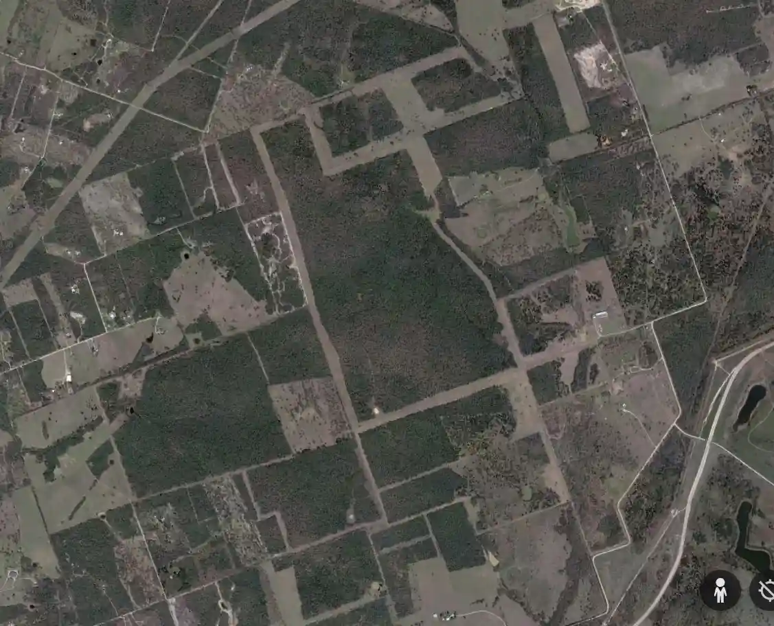 a satellite image shows a rural landscape with patchwork fields, forests, and dirt roads. A text overlay reads: 'this is…