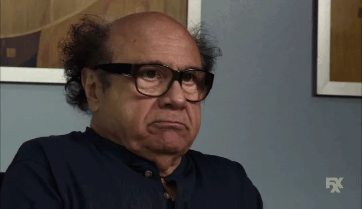 six panels show a man with glasses and curly hair wearing a dark blue shirt, his expression shifting from neutral to sad as…