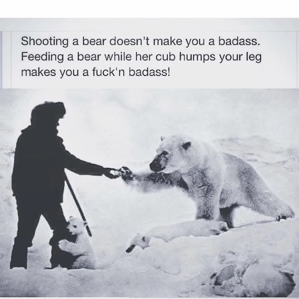 A black-and-white photo shows a person in silhouette feeding a polar bear in the snow, with a cub nearby. The overlaid text…