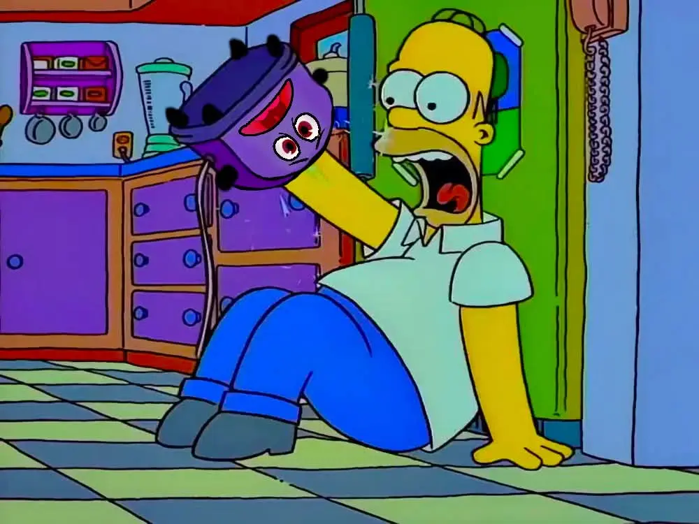 Homer Simpson is sitting on a checkered kitchen floor, screaming in terror as a purple, cartoonish vacuum cleaner with a…