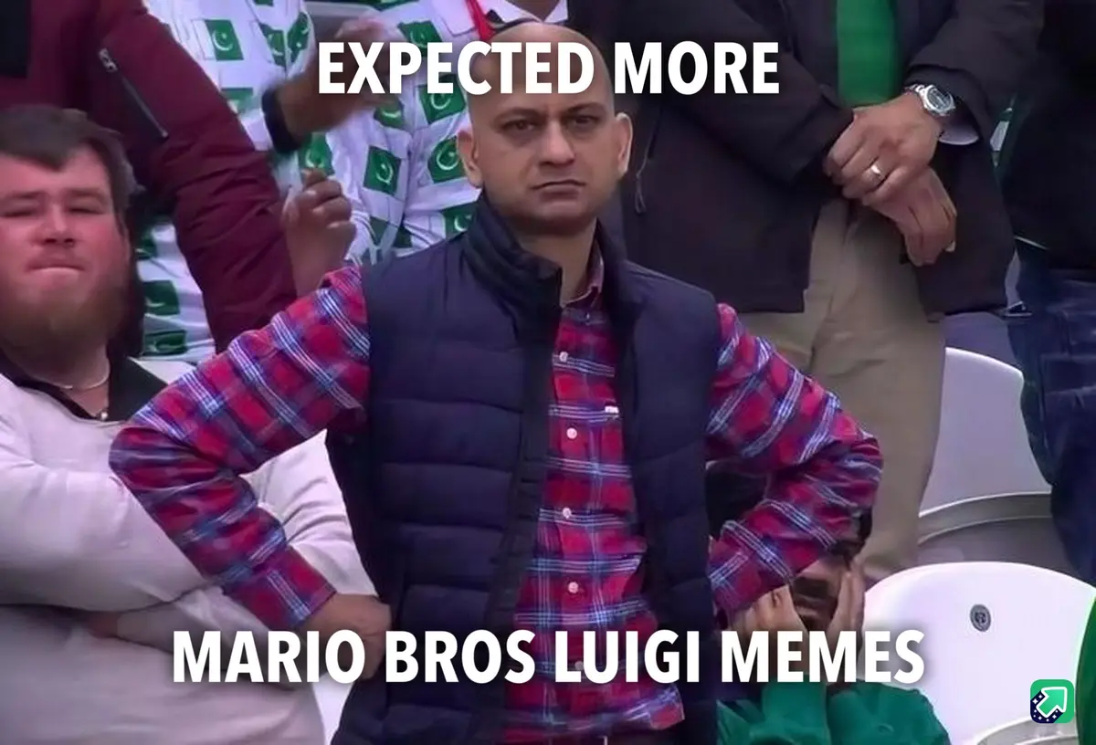 A bald man in a red plaid shirt and black vest stands with hands on hips in a stadium, looking disappointed. White text…