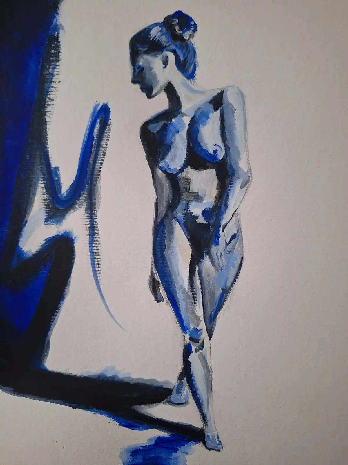 A blue-toned painting depicts a nude woman standing in profile, looking at her reflection in a mirror. The mirror shows a…