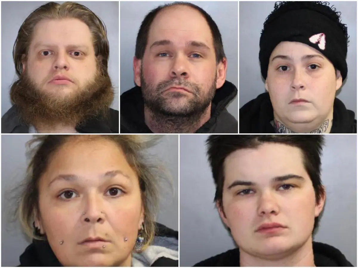 Five mugshot-style photos of different individuals arranged in a grid, each with a neutral or stern expression. The top row…