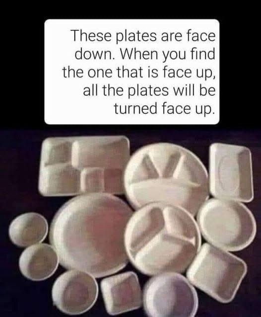 An overhead shot of various white disposable plates and bowls, all lying upside down on a dark surface. A white text box at…