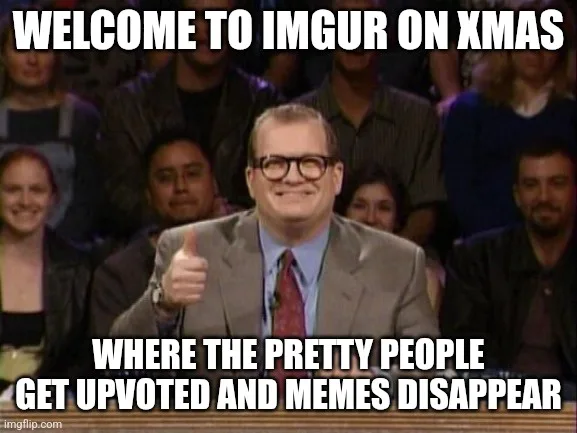A man in a suit and glasses gives a thumbs-up while seated in front of an audience. White bold text overlays the image…