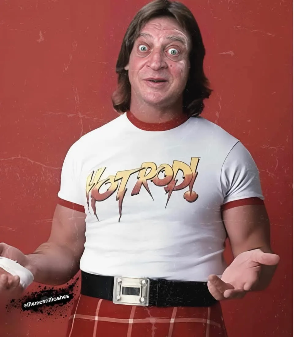 A man with long brown hair and wide eyes wears a white t-shirt with 'HOT ROD!' in stylized orange lettering, red-trimmed…