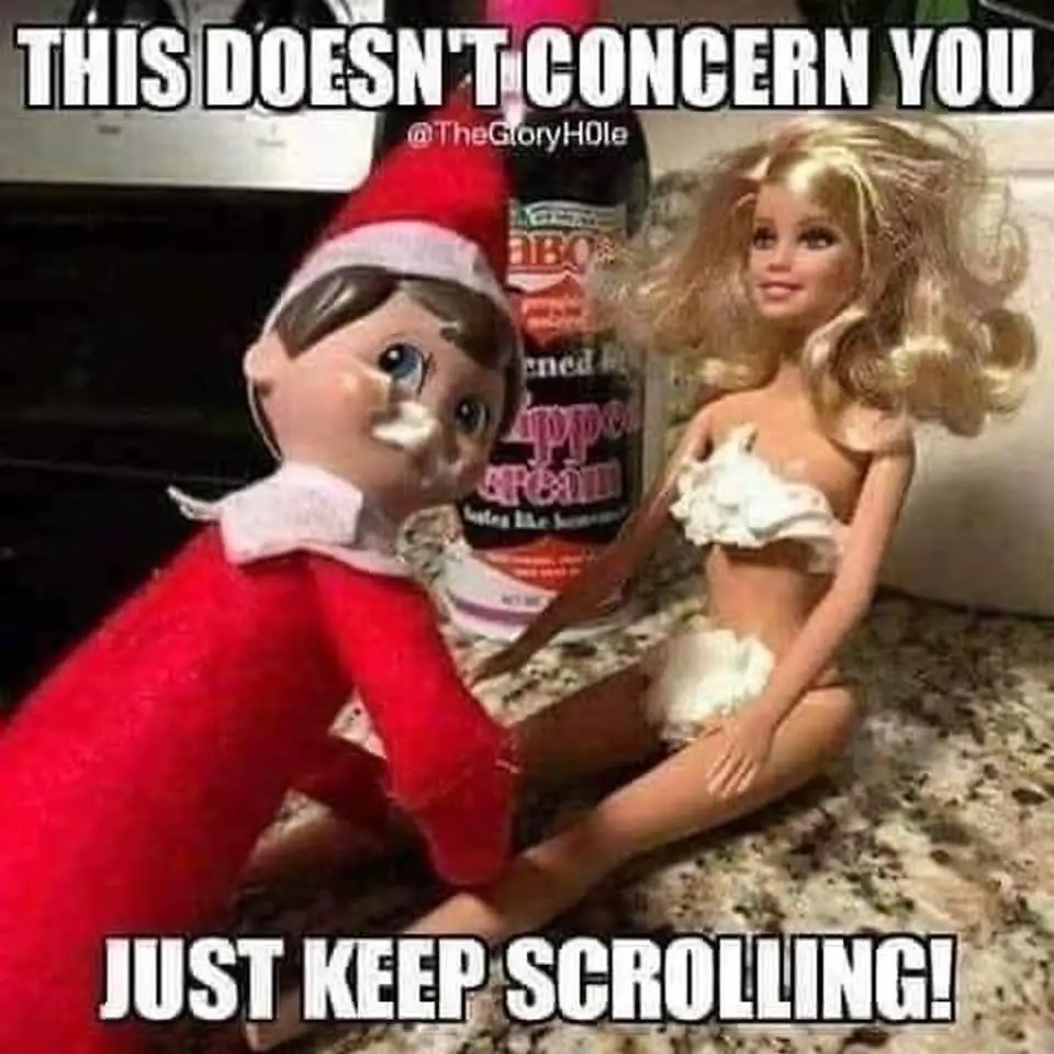 An elf doll with a smear of white substance on its face is positioned next to a Barbie doll wearing a white, ruffled top and…