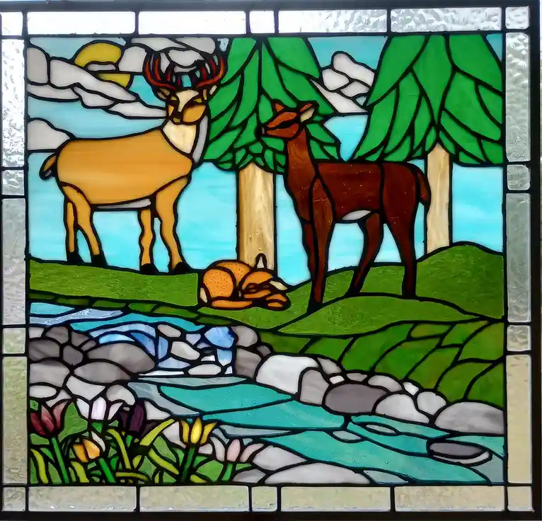 A stained glass window depicts a serene forest scene with two deer standing near trees, a sleeping fox on the grass, a…