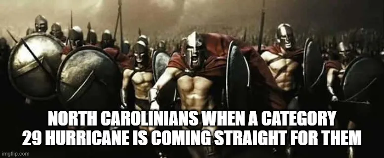 A dramatic image of Spartan warriors in formation, brandishing shields and spears, with a central figure roaring forward…
