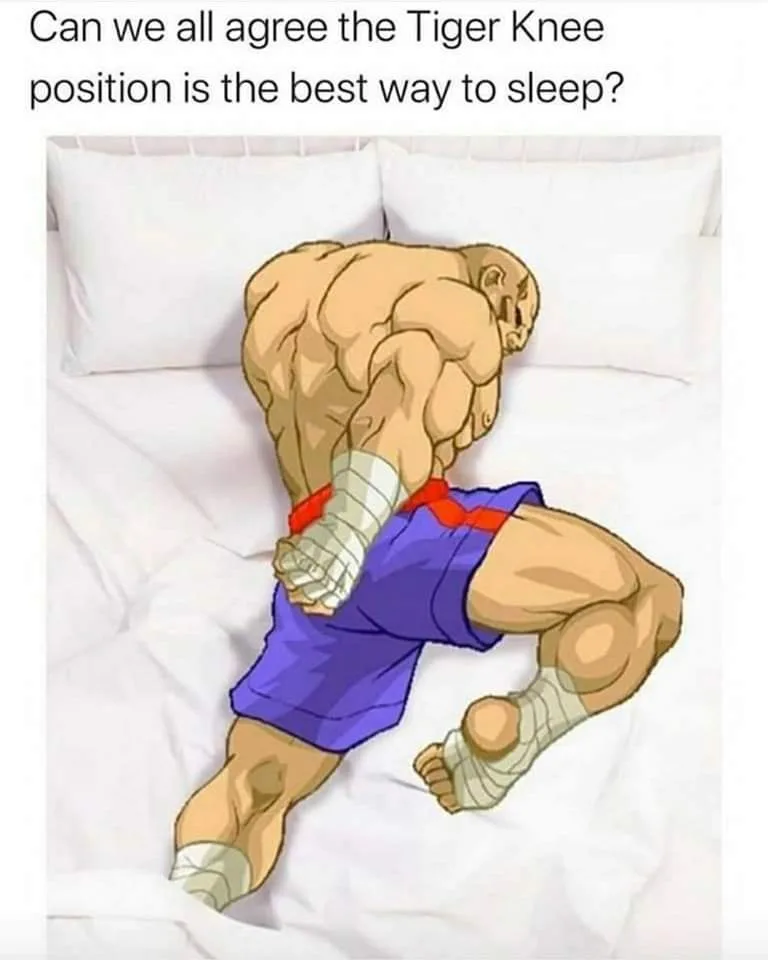 A cartoon illustration of a heavily muscled, bald man in blue shorts and white foot wraps is shown sleeping on a white bed…