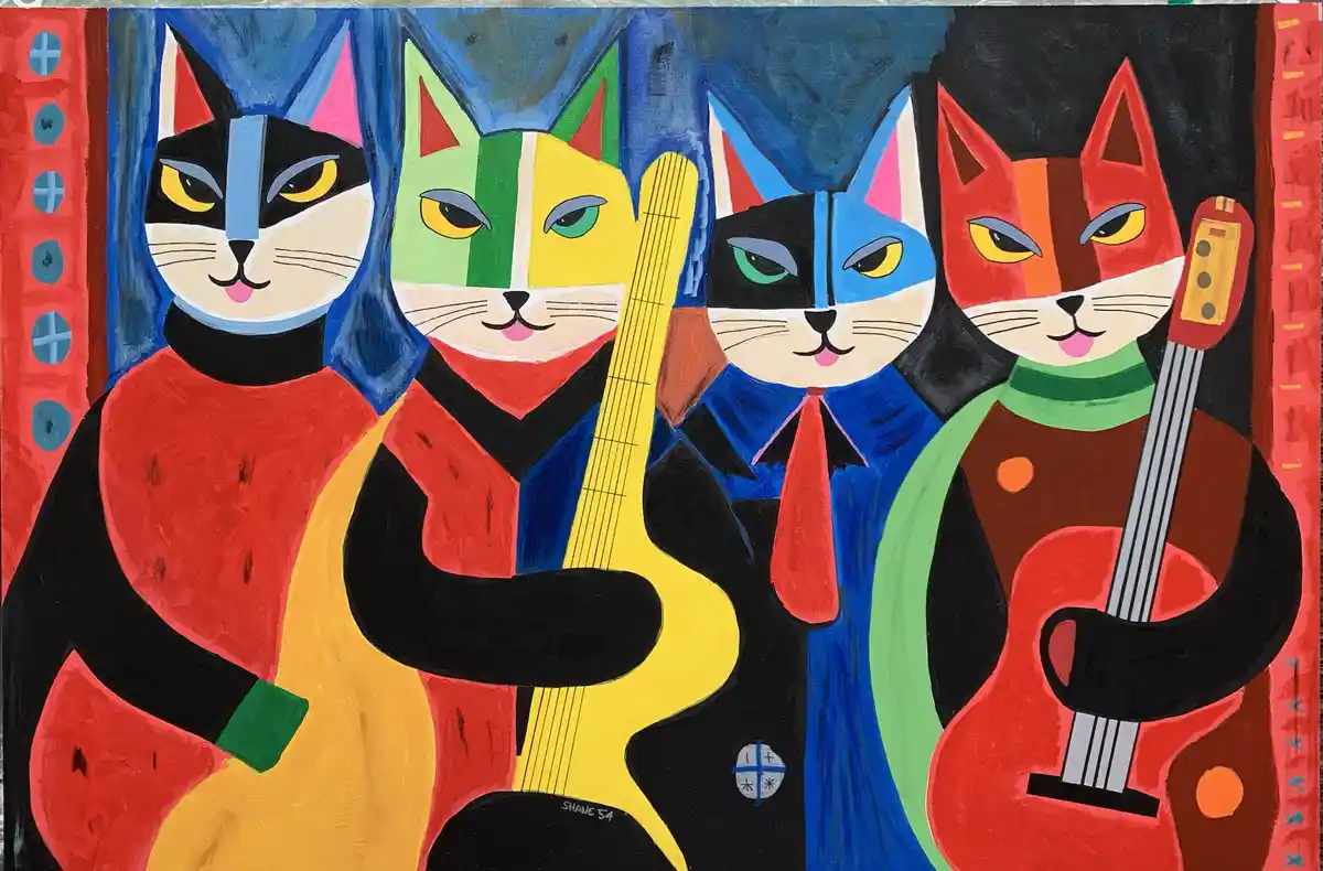 A colorful, stylized painting depicts four anthropomorphic cats dressed in human clothing and holding guitars, standing side…