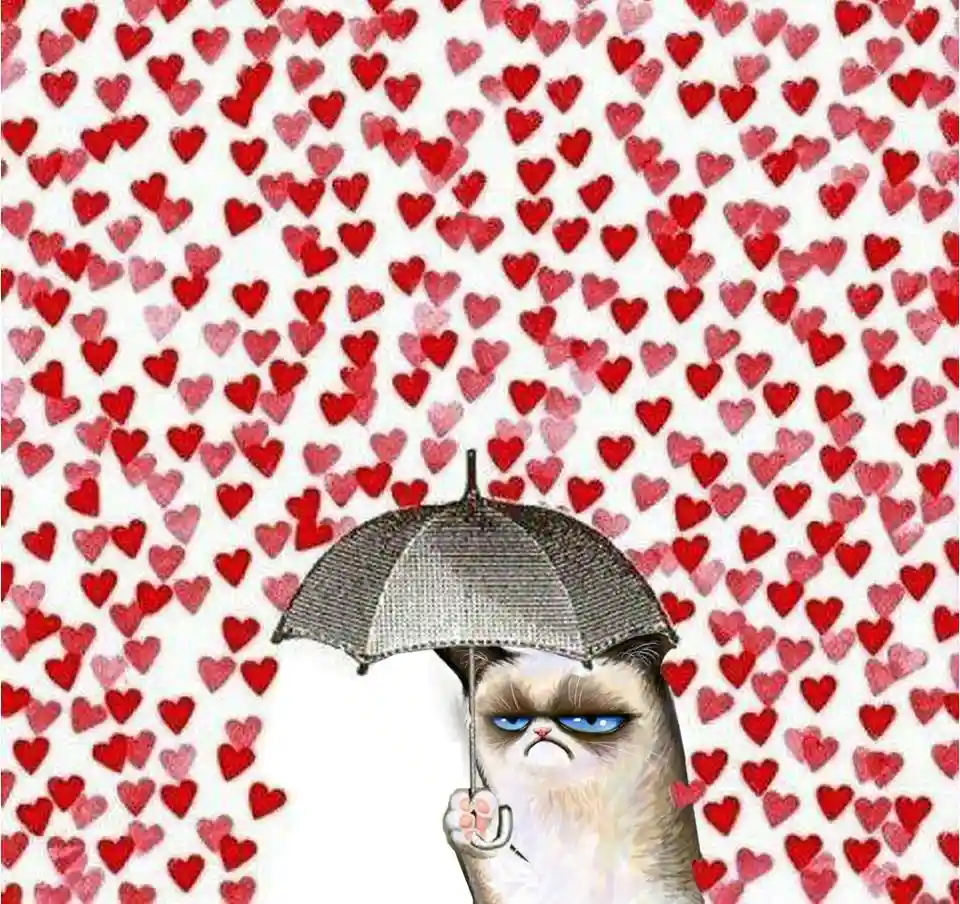 A grumpy-looking cat with blue eyes holds a silver umbrella, standing in front of a background filled with red hearts of…