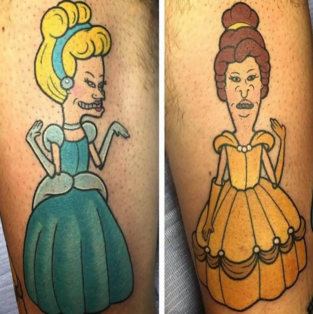 Two tattoos side-by-side show Disney princesses Cinderella and Belle with exaggerated, distorted facial features like long…