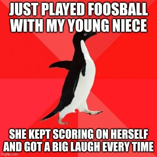 A black-and-white penguin stands on a red background with bold white text. The top text reads 'JUST PLAYED FOOSBALL WITH MY…