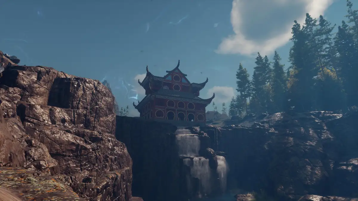 A red and gold traditional East Asian temple with curved roofs sits atop a rocky cliff overlooking a waterfall, surrounded…