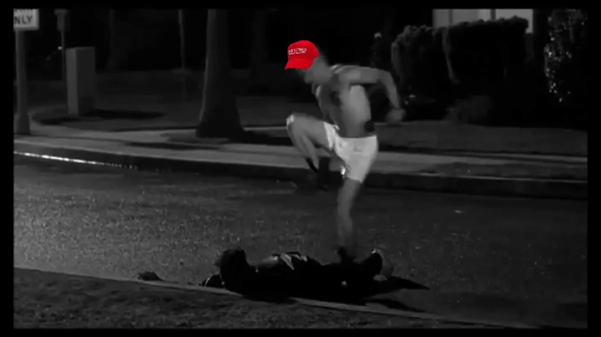A black-and-white nighttime street scene shows a shirtless man in white shorts standing over another person lying motionless…