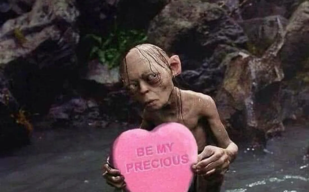 A pale, emaciated, and grotesque creature with large ears and a wrinkled face stands in murky water holding a large pink…