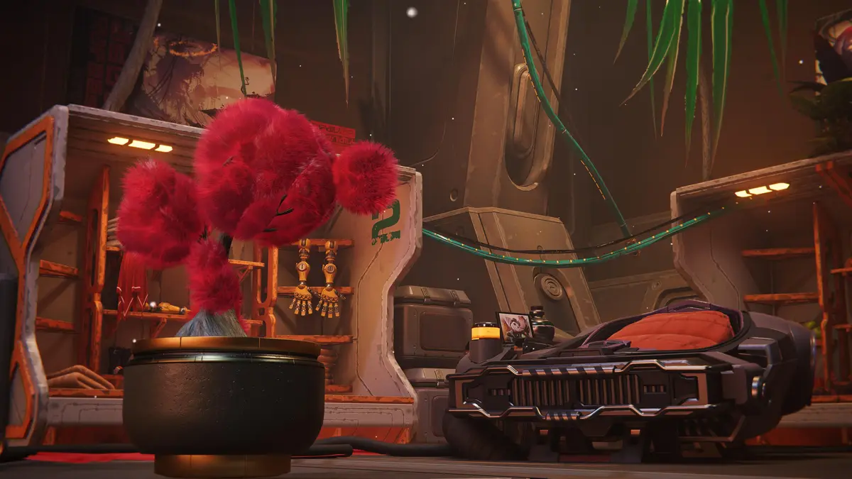 A red, fluffy, four-limbed creature with pom-pom-like appendages stands in a sci-fi room with orange and gray machinery…