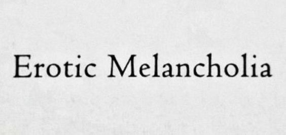 The image displays the phrase 'Erotic Melancholia' in a classic serif font centered on a textured, off-white background…