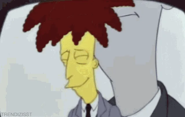 A six-panel animated GIF shows the character Milhouse Van Houten from The Simpsons, wearing a grey suit and tie…