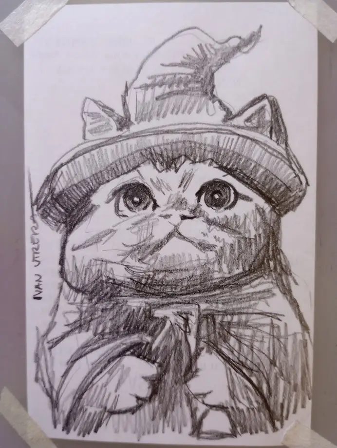 A pencil sketch of a cat wearing a wizard's hat and a scarf, taped to a surface. The cat has large, expressive eyes and a…