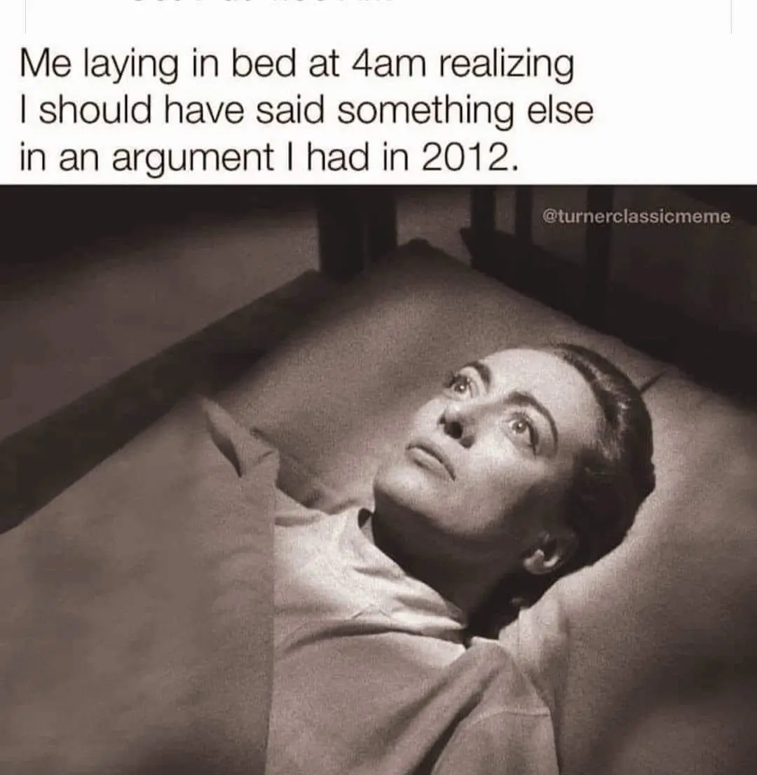 A black-and-white image shows a woman lying in bed, looking upward with a wide-eyed, startled expression. The overlaid text…