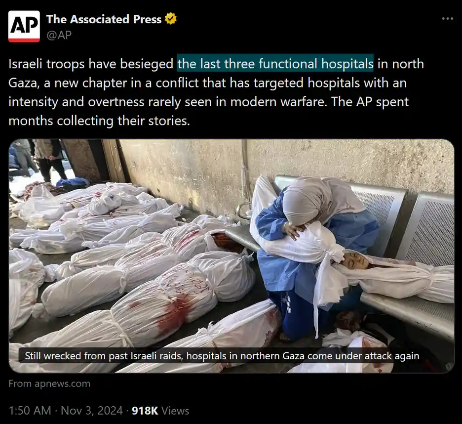 A somber image shows a woman in blue scrubs and a white headscarf kneeling beside a hospital bench, mourning over a body…