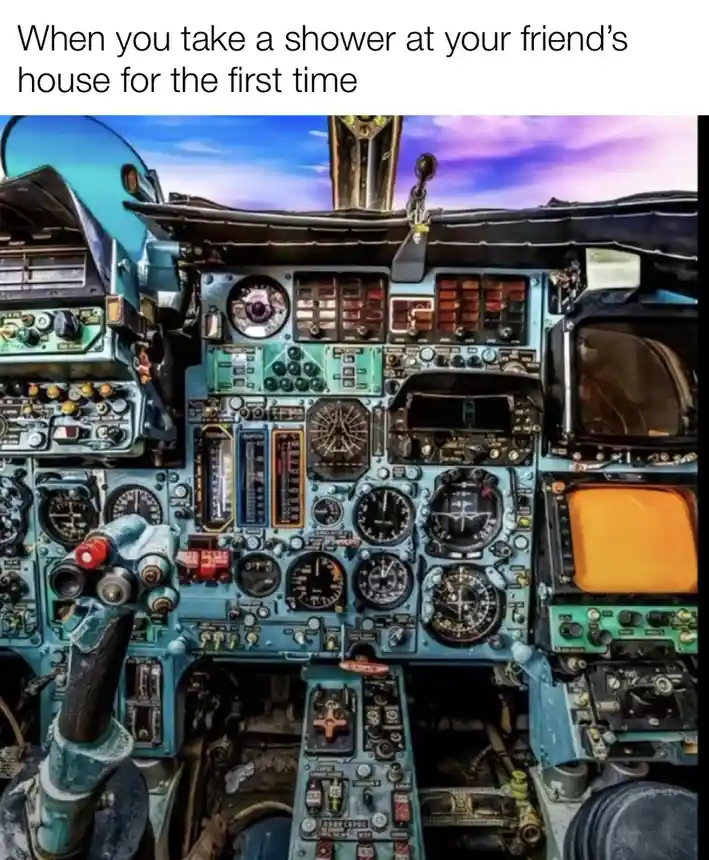 The image shows a complex, cluttered airplane cockpit filled with numerous dials, gauges, switches, and control levers, all…