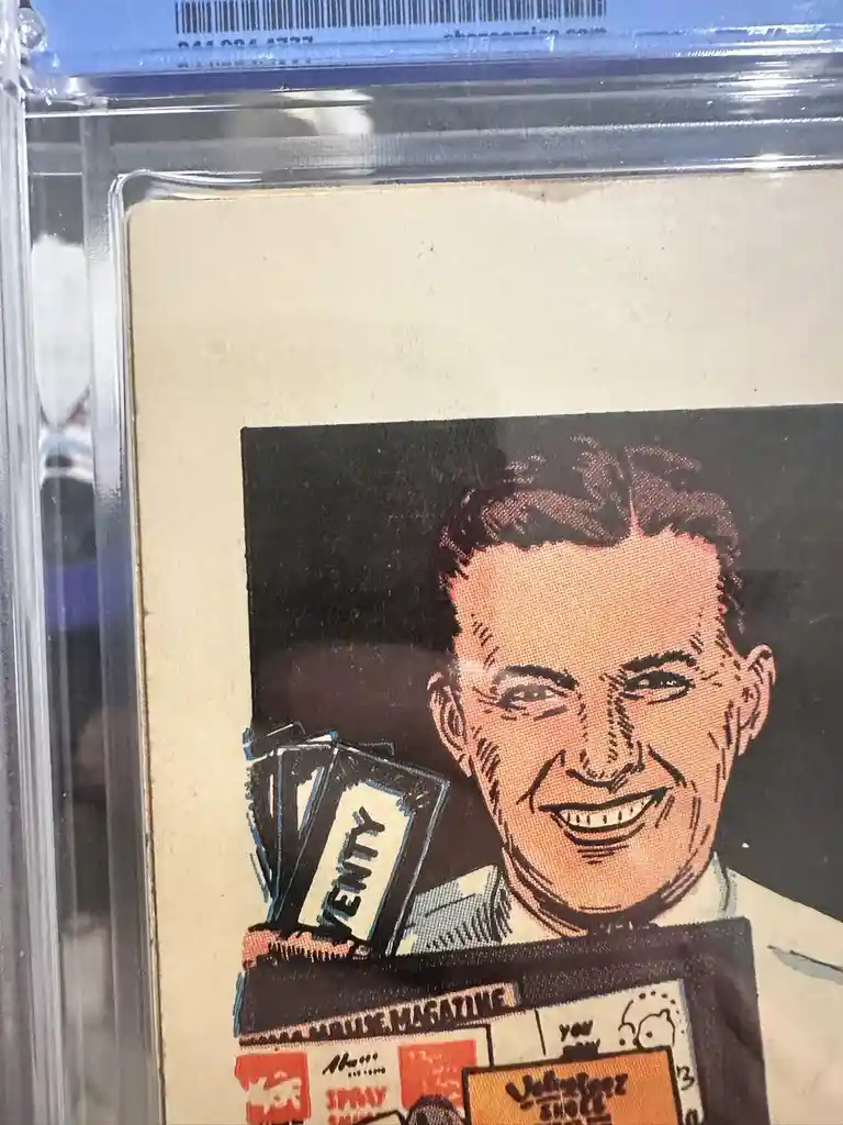 A vintage comic book cover featuring a smiling man holding a stack of magazines, one prominently labeled 'TWENTY'. The comic…