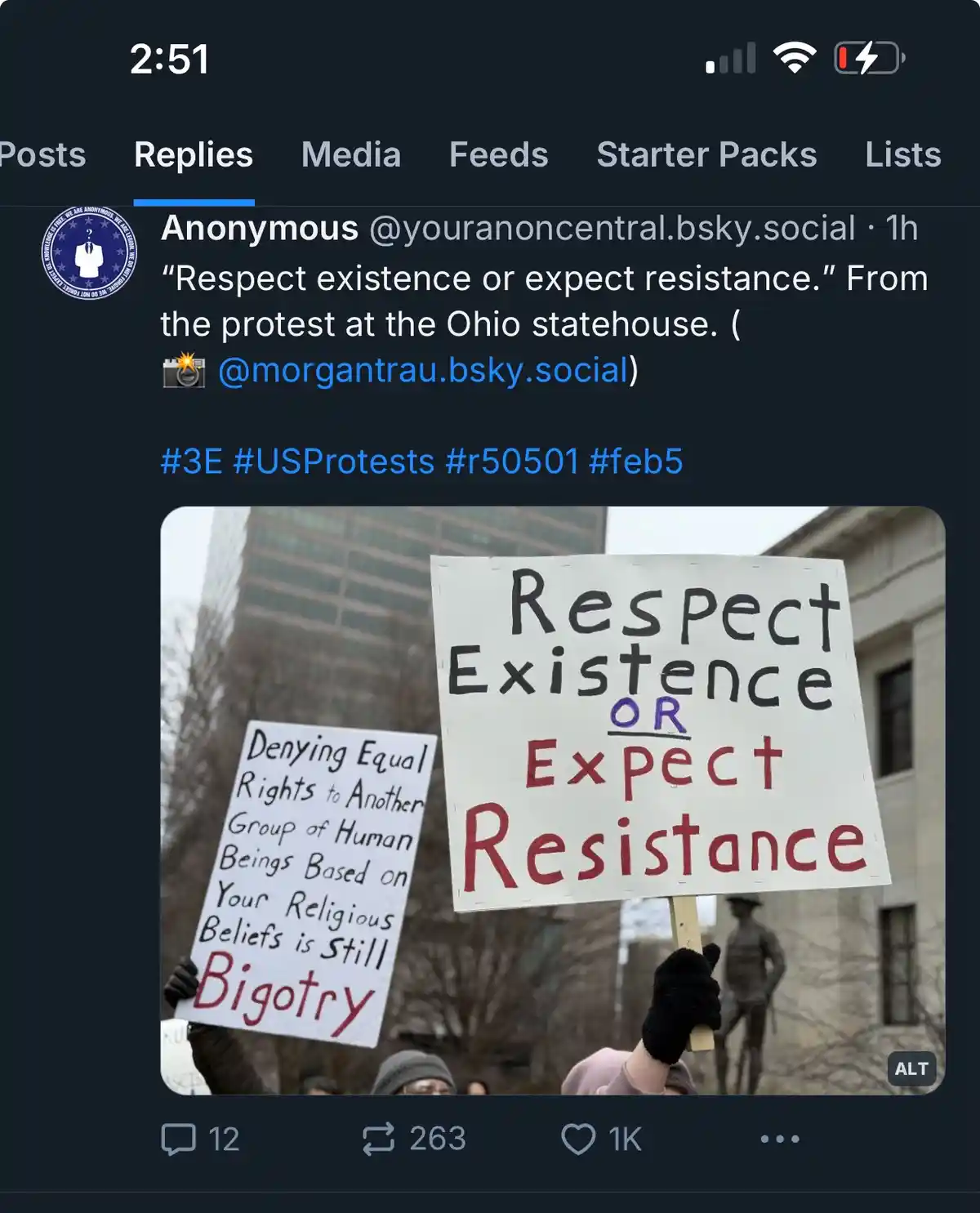 A screenshot of a social media post showing two protest signs at the Ohio statehouse. The main sign reads 'Respect Existence…