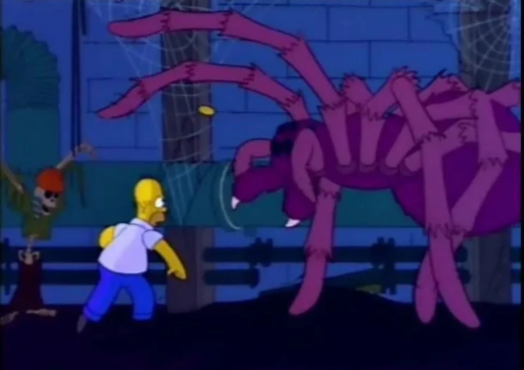 Homer Simpson runs away in terror from a giant, menacing purple spider with multiple legs and fangs, while a skeleton in a…
