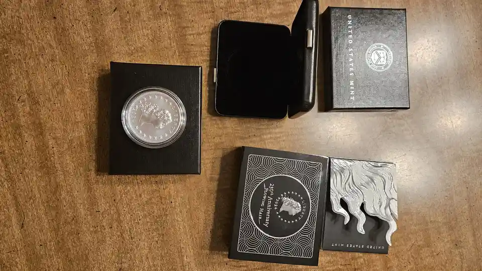A 2024 United States Mint silver coin, labeled '230th Anniversary Flowing Hair', is displayed in its black presentation box…