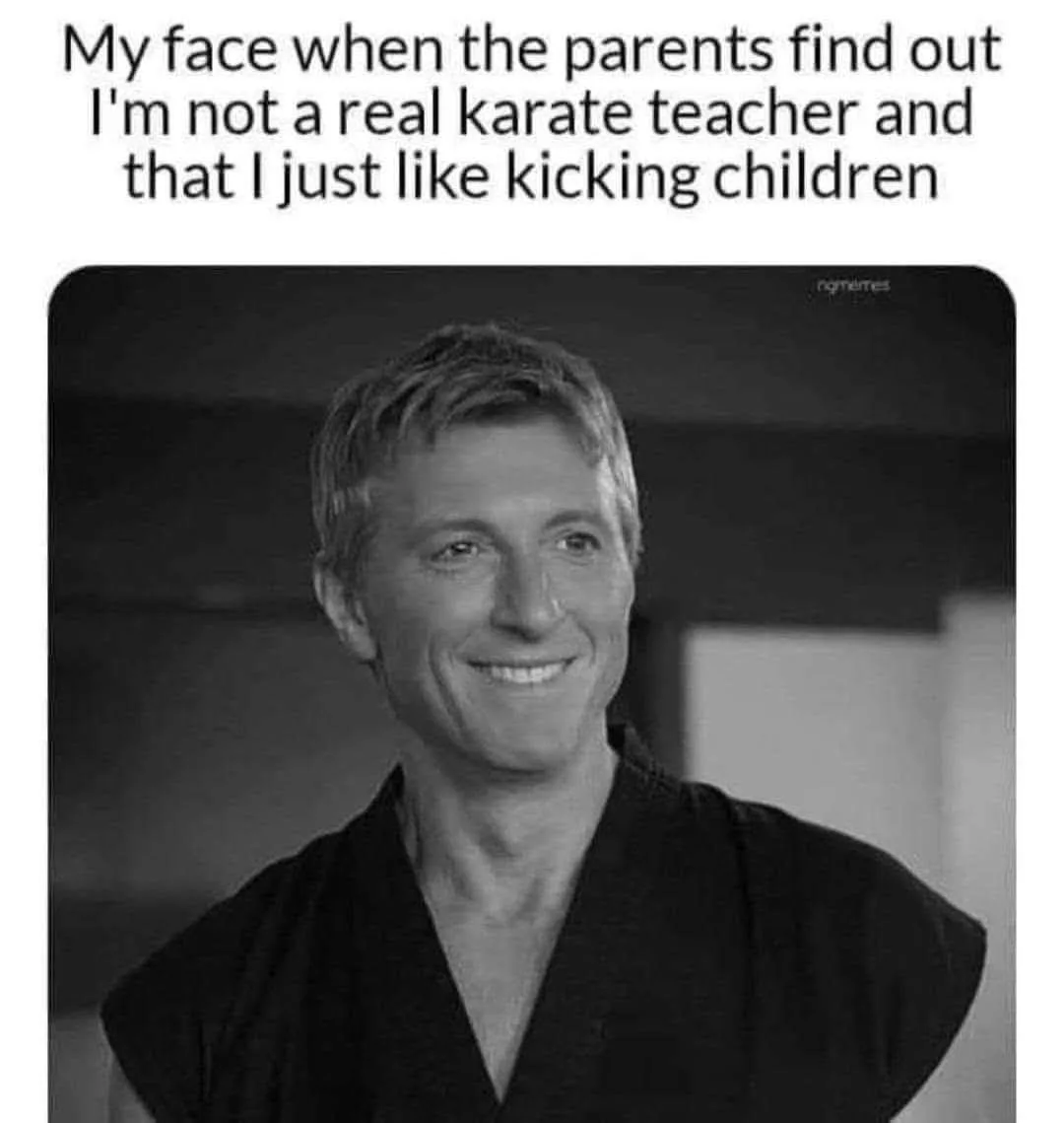 A black and white photo of a man in a karate gi smiling broadly. The overlaid text reads: 'My face when the parents find out…
