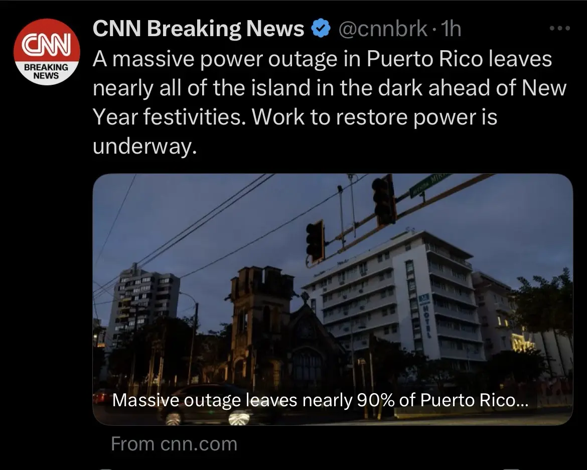 A screenshot of a CNN Breaking News tweet about a massive power outage in Puerto Rico, showing a dark city street with…