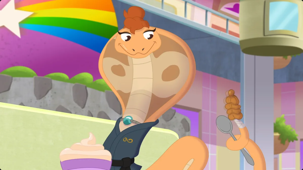 A cartoon cobra with brown hair in a bun, wearing a dark blue jacket with a gold emblem and a turquoise pendant, sits at a…