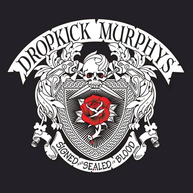 A black background features a white ornate crest with a skull above a shield containing a red rose. The band name 'DROPKICK…