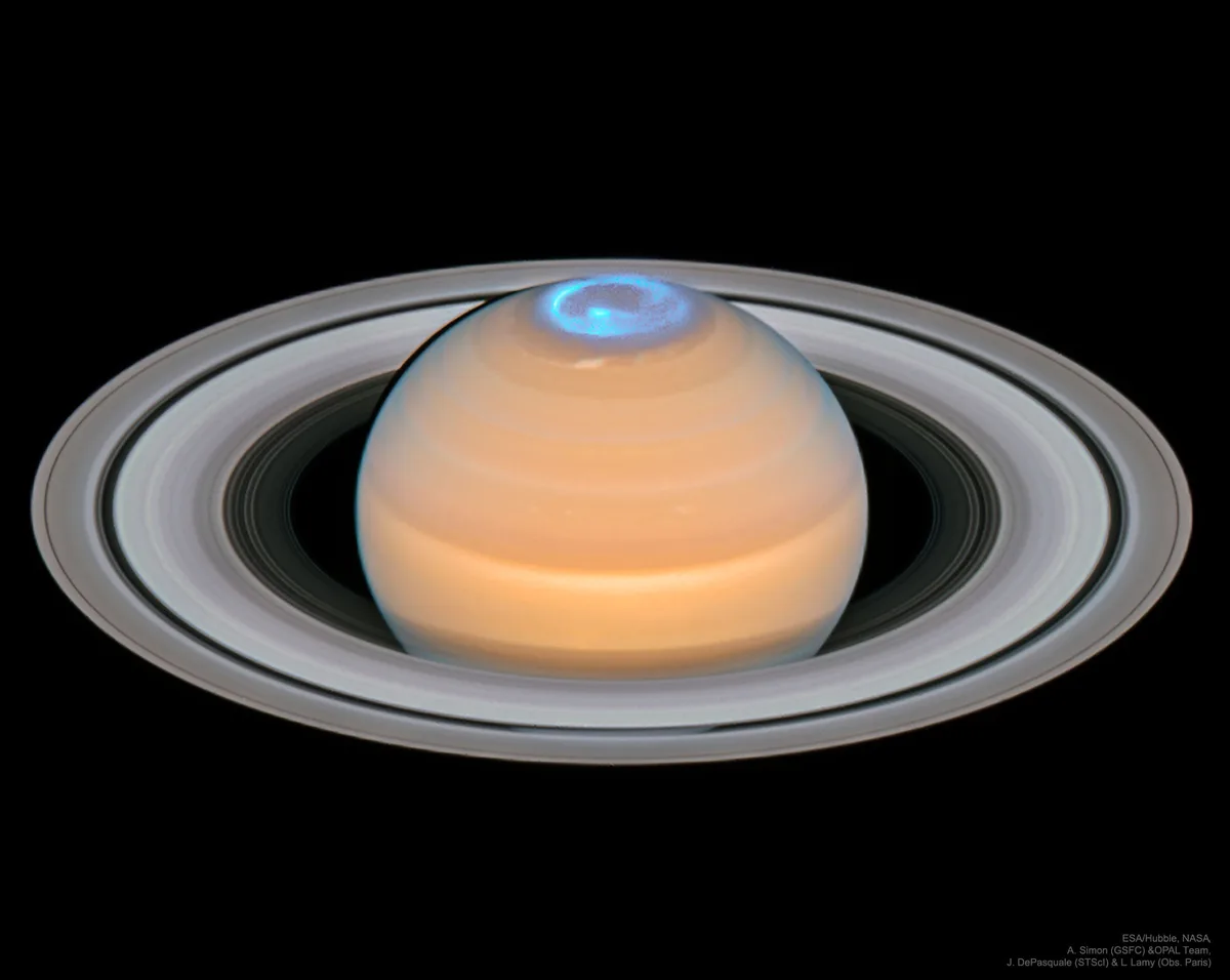 The image shows the planet Saturn with its iconic rings, but the top of the planet has been digitally altered to resemble a…