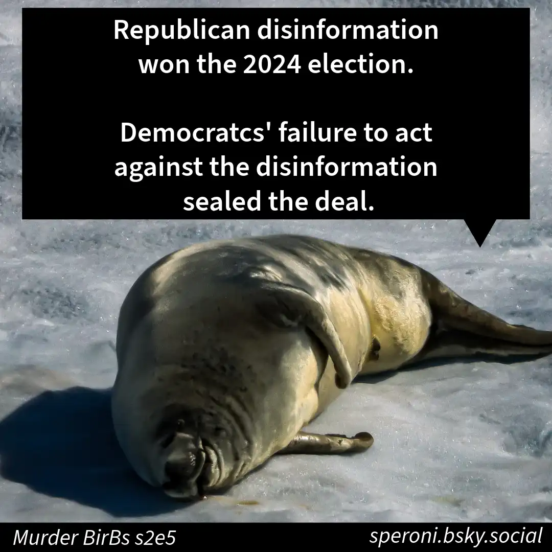 A large seal lies motionless on a snowy or icy surface, appearing defeated or dead. A black speech bubble overlay contains…