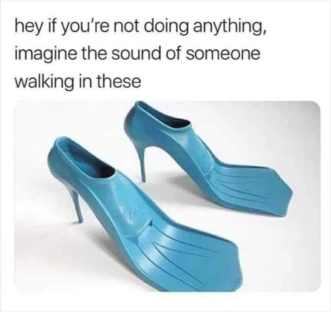 The image shows a pair of bright blue high-heeled shoes that are also designed as swim fins, combining a stiletto heel with…