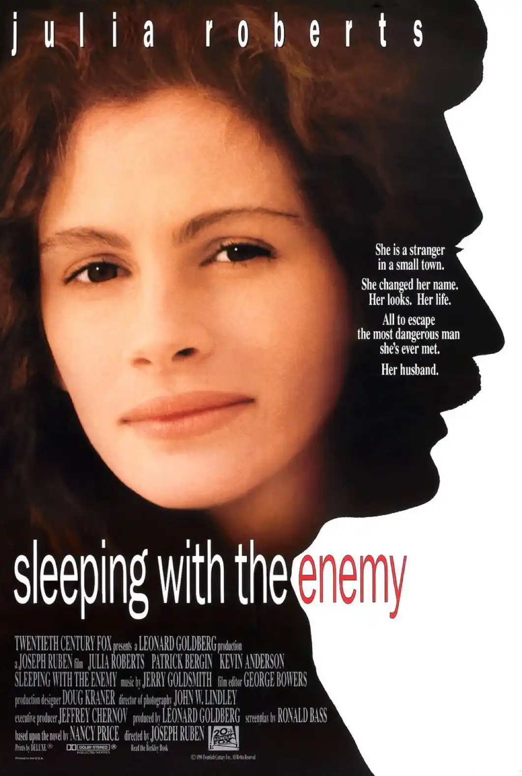 This is a movie poster for 'Sleeping with the Enemy' starring Julia Roberts. The poster features a close-up of Roberts with…