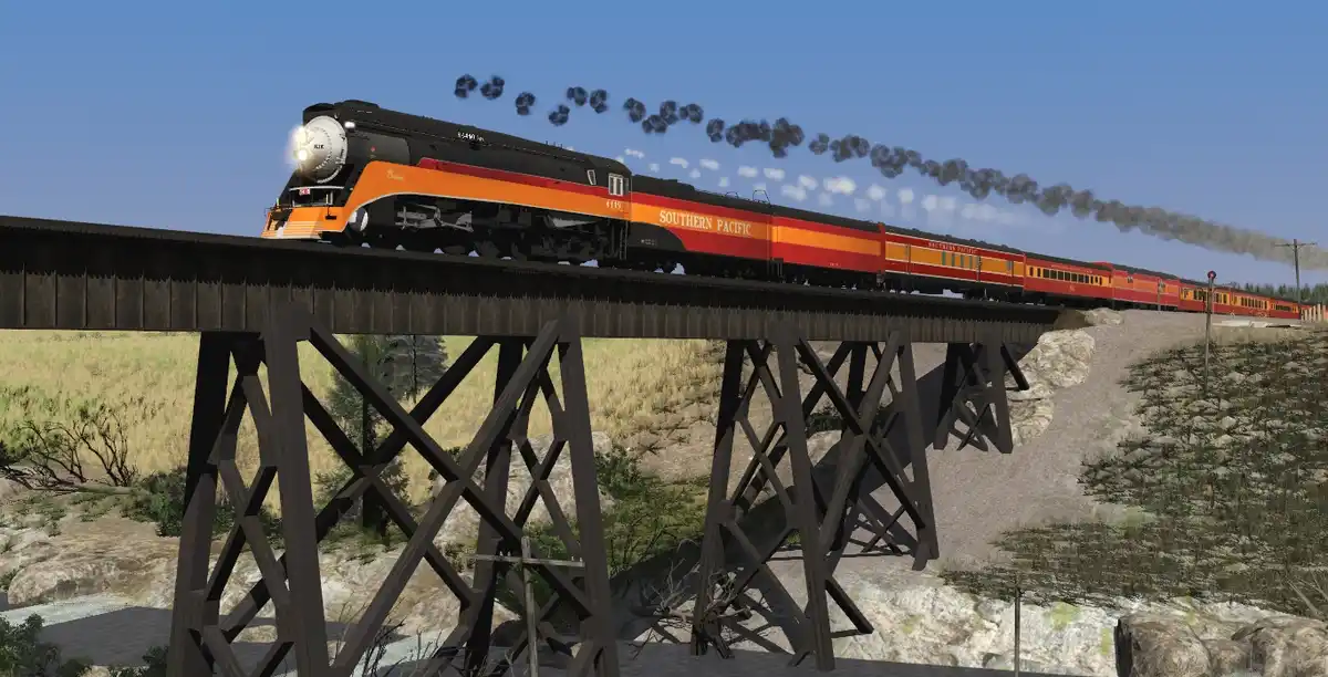 A Southern Pacific steam locomotive pulls a long red passenger train across a wooden trestle bridge in a rocky, arid…