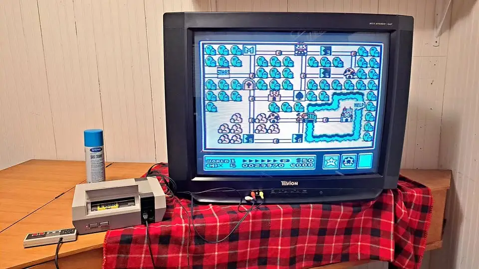 A vintage CRT television displays a pixelated game resembling the classic Nintendo game 'The Legend of Zelda' with a…
