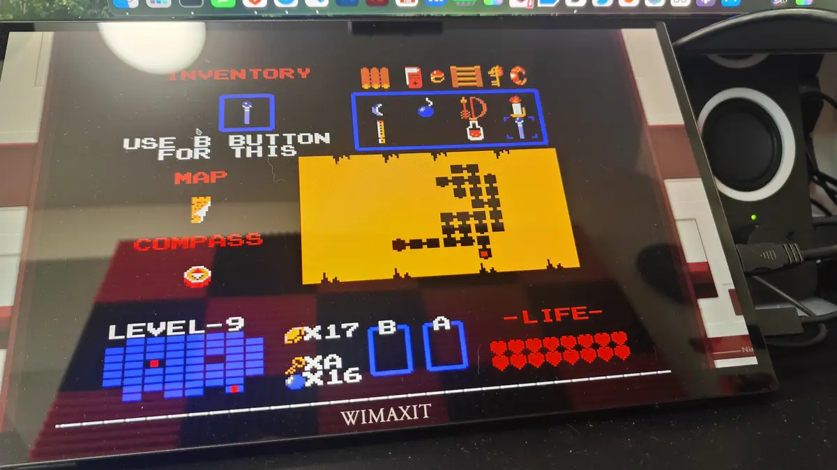 A screenshot of a retro-style video game inventory screen on a Nintendo Switch, showing pixelated items like a map, compass…