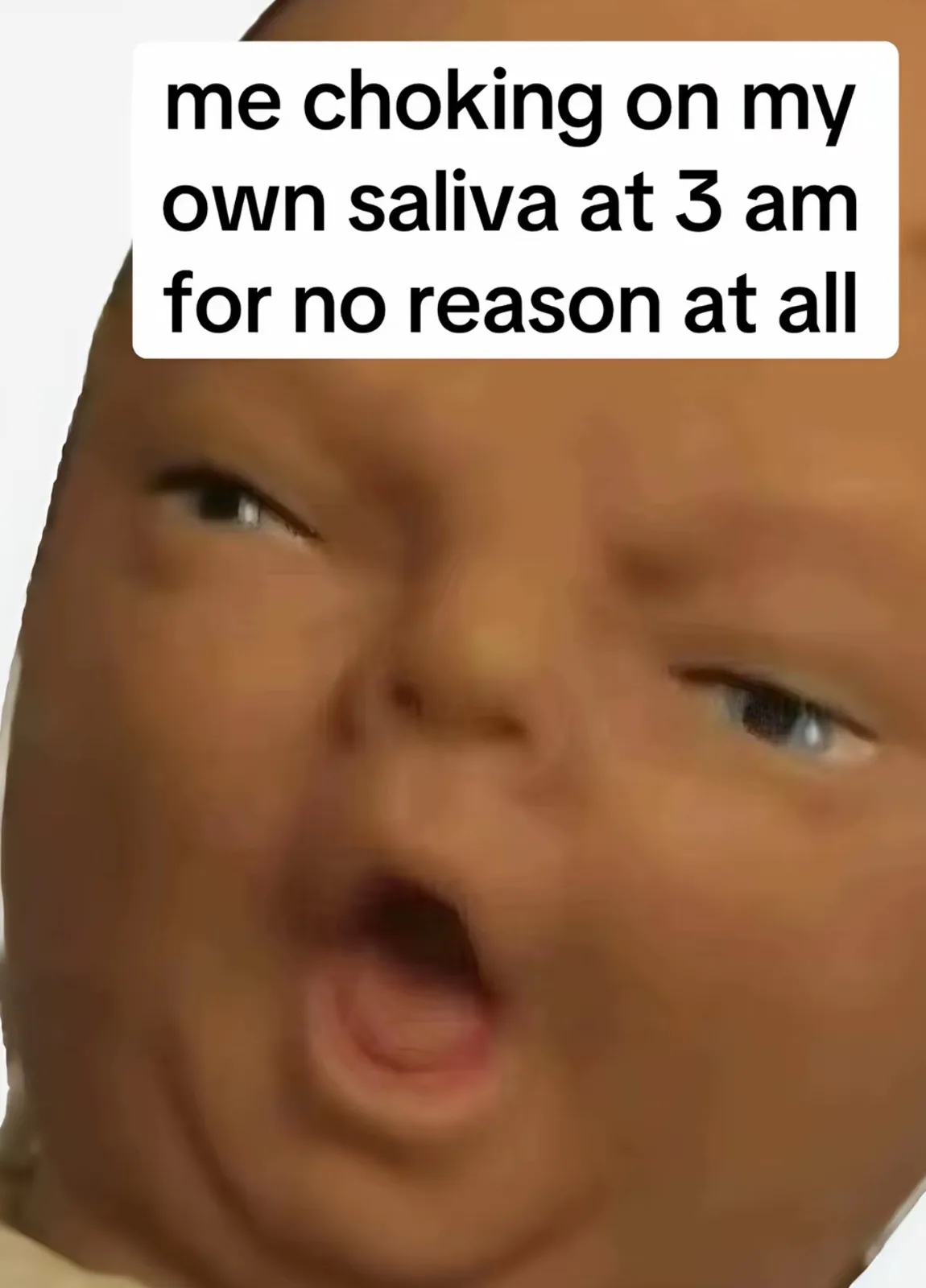 A close-up image of a baby with wide eyes and an open mouth, conveying a look of shock or surprise. Overlaid text reads 'me…
