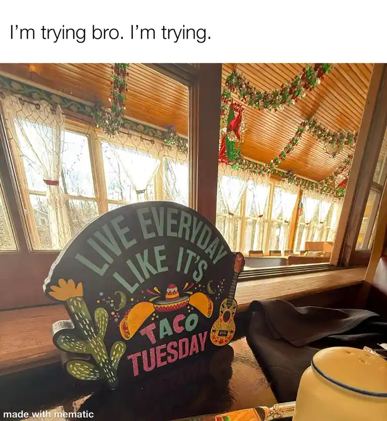 A wooden sign shaped like a taco reads 'LIVE EVERYDAY LIKE IT'S TACO TUESDAY' and is decorated with cacti, tacos, a…